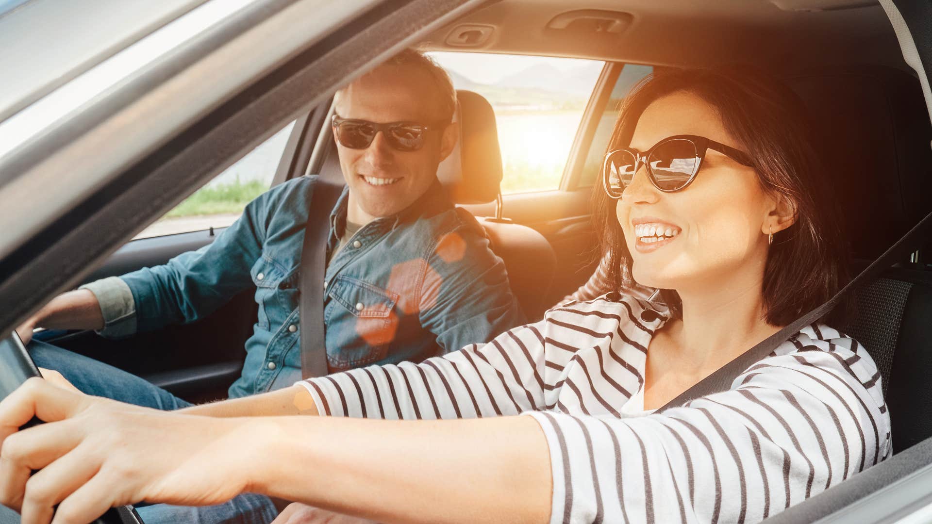 woman driving with man in passenger seat